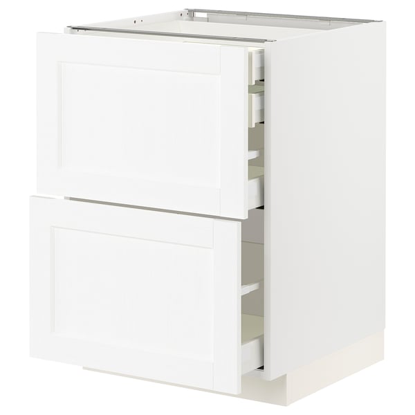 Un meuble de cuisine blanc ikea METOD avec tiroirs et étagères. Il a un design épuré et classique avec une texture subtile de grain de bois.