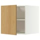 Armoire blanche ouverte avec porte en bois, deux étagères, forme carrée.
