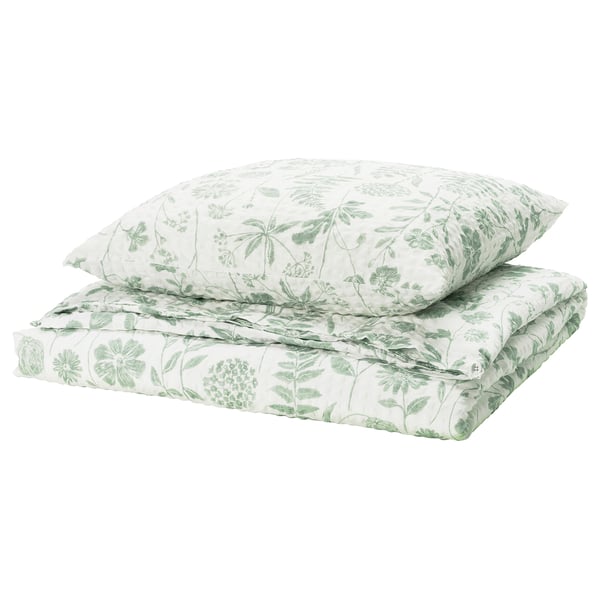Ensemble de literie florale vert et blanc avec des motifs de feuilles.