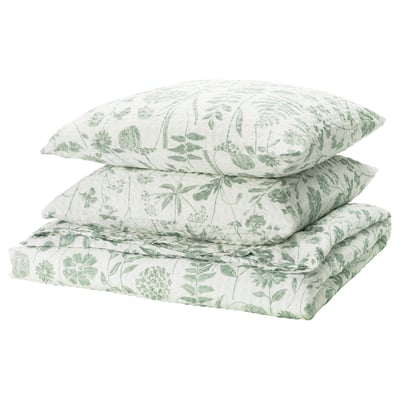 Ensemble de literie florale verte NÅLBJÖRNBÄR, texture légère seersucker, blanc avec fleurs vertes.