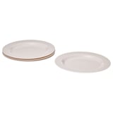 Pile de quatre plaques de verre trempé blanches, rondes et ornées d’un bord perlé, adaptées aux repas.