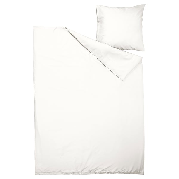 Parure de lit blanche PILTANDVINGE : couette et oreiller, tissu lisse, design minimaliste.