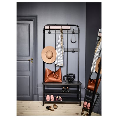 Étagère à chaussures en métal avec banc et crochets pour manteaux, sacs et chapeaux.