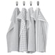 Quatre serviettes grises à motifs carrés et rayés pendent soigneusement, deux à carreaux, deux à rayures, toutes en coton blanc et gris.