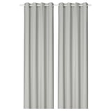 Paire de rideaux transparents gris clair avec un élégant design d’œillets pour des plis doux.