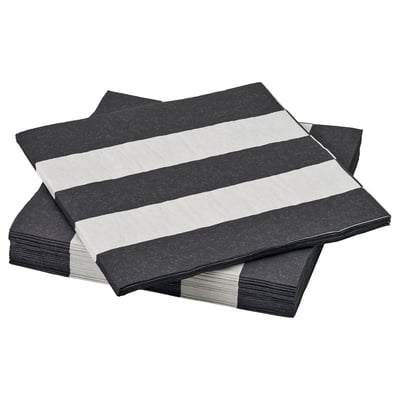 Serviettes empilées à rayures noires et blanches, soigneusement pliées, idéales pour les salles à manger.