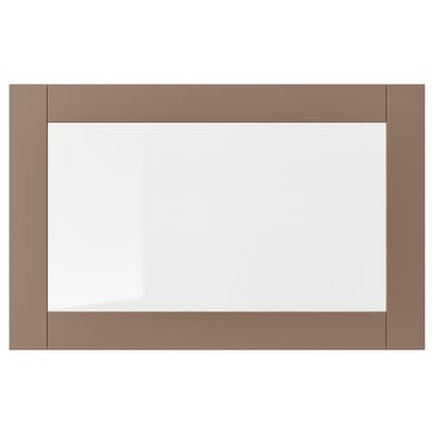 Une porte d’armoire rectangulaire SINDVIK, gris-brun clair avec du verre transparent au centre. Il a des lignes épurées et modernes.