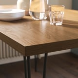 SKÅLSTA Table et 4 chaises, motif noyer épingle à cheveux noir-gris/plastique noir tubulaire métal/noir-gris, 140x80 cm