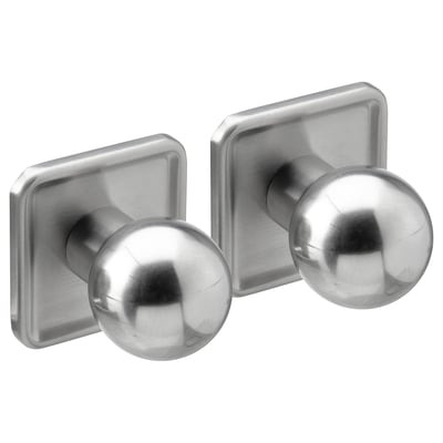 Deux boutons ronds en acier inoxydable sur des plaques carrées, design rétro moderne.