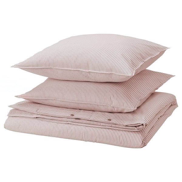 Pile d’oreillers rayés rouges et blancs, drap plié, coton, design minimaliste.