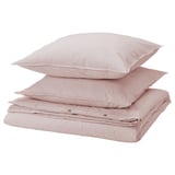 Pile d’oreillers rayés rouges et blancs, drap plié, coton, design minimaliste.