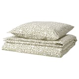 Parure de lit pliée à motifs de feuilles vertes avec couette et taies d’oreiller, polyester et coton recyclés écologiques.