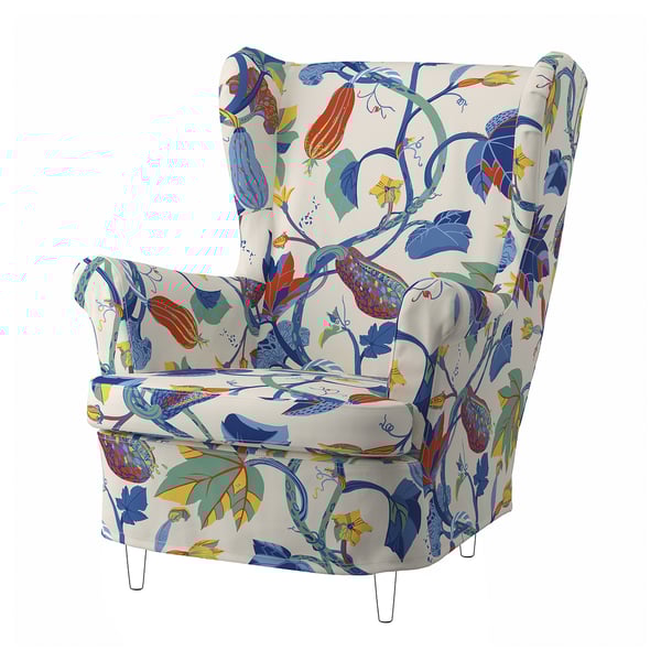 Fauteuil blanc fleuri, dossier haut, imprimé feuilles colorées, pieds en bois.