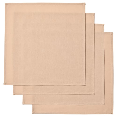 Quatre serviettes rectangulaires en coton beige soigneusement empilées, avec un tissage texturé subtil et des bords ourlés.