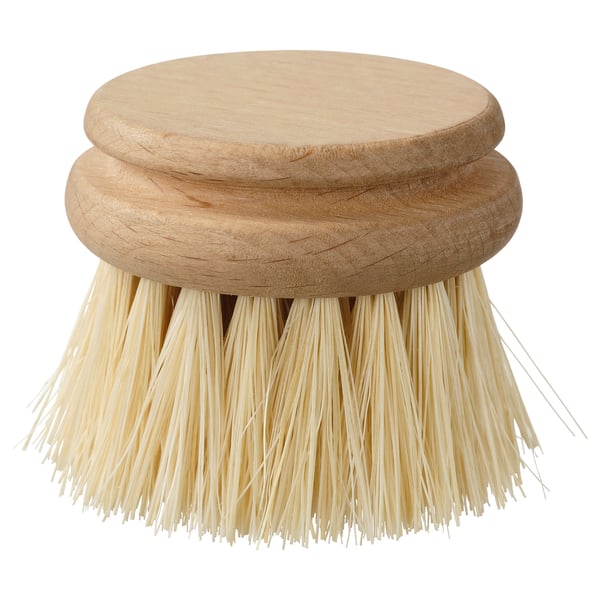 Pinceau rond en poils naturels sur fond blanc.