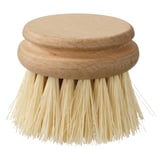 Pinceau rond en poils naturels sur fond blanc.