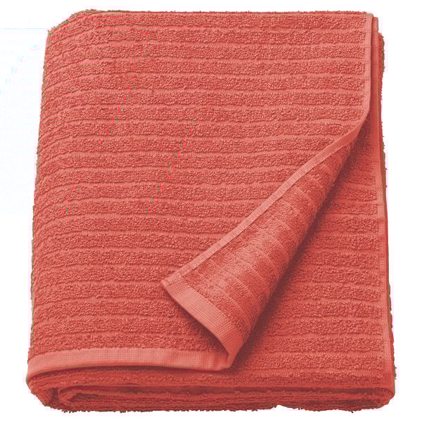 Serviette VÅGSJÖN orange vif, pliée, 100 % coton, douce, absorbante, texture côtelée.