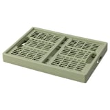 Une boîte pliante VEDKLYV en vert, en plastique polypropylène. Son rectangulaire avec des côtés ventilés pour la circulation de l’air.