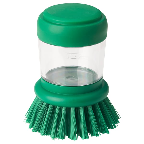 Brosse à vaisselle verte avec réservoir de liquide et valve en silicone.
