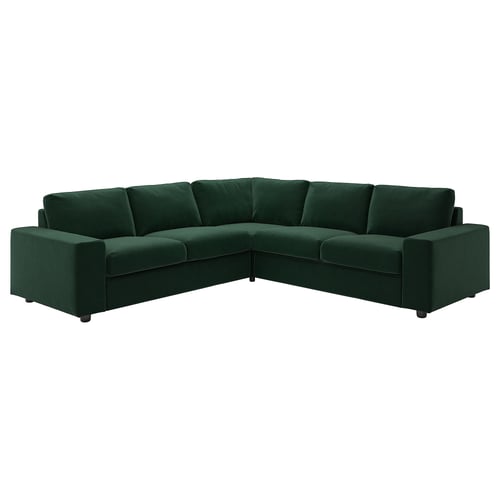 Un canapé sectionnel VIMLE en forme de L vert foncé avec des coussins moelleux et des pieds en bois.