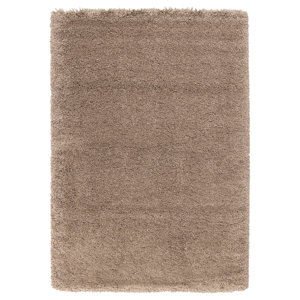 Tapis à poils longs beige VOLLERSLEV, doux et texturé, rectangulaire avec surface moelleuse.