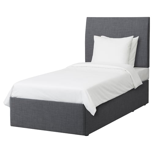 A grey BALESTRAND bed with white linens and a grey upholstered headboard and frame.