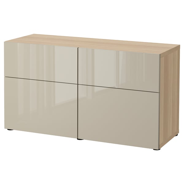 IKEA BESTÅ beige sideboard with 4 doors, wooden top, and adjustable shelves.