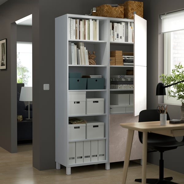Modern storage unit with adjustable shelves and doors, both open and closed, displaying items and storing others.