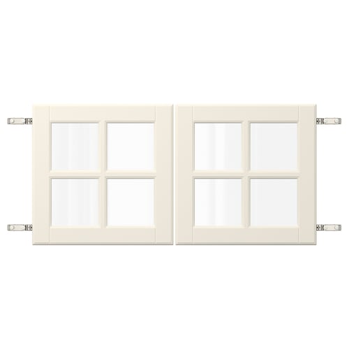 Two cream-colored cabinet doors with glass panels and metal hinges.