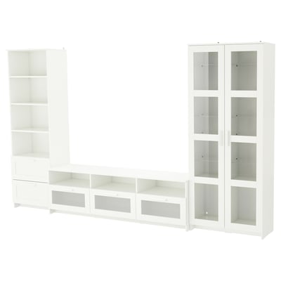 A white BRIMNES tv storage unit set. It adjustable shelves, drawers, and glass doors for organised storage.