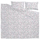 BRUDKRUSBÄR duvet set in floral white with blue and orange dots, 100% organic cotton.
