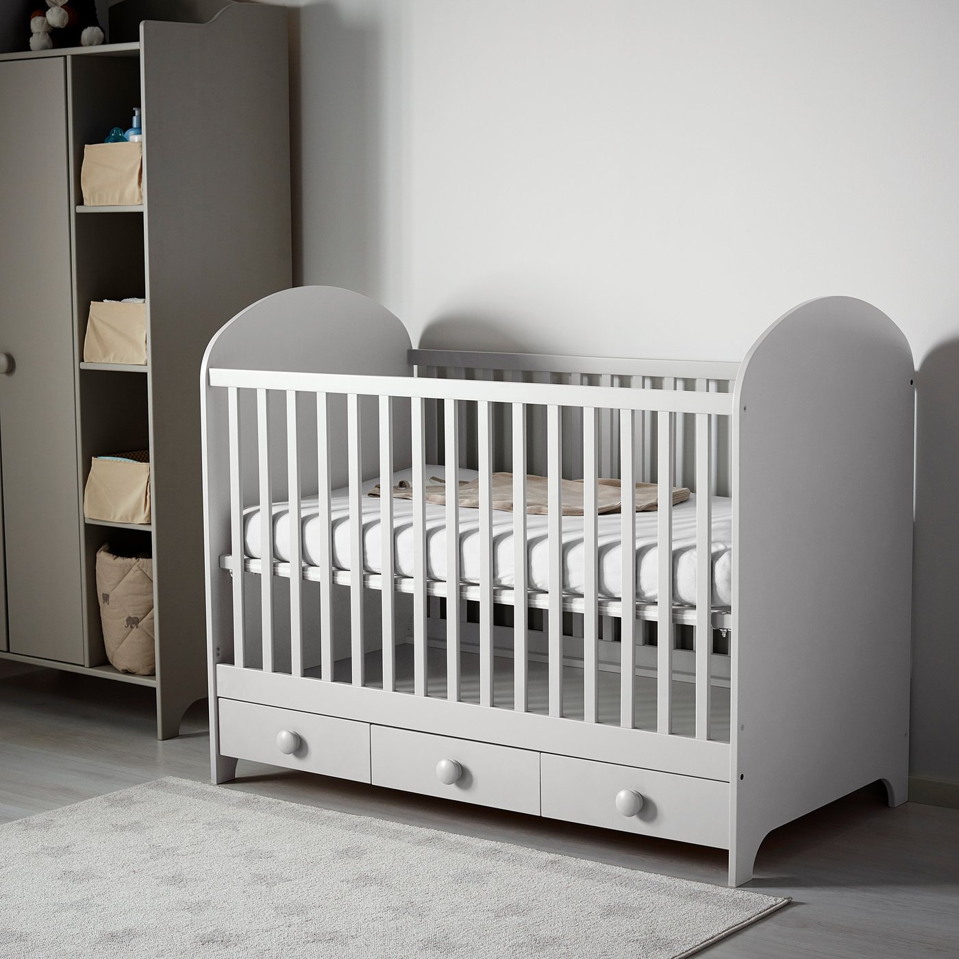 grey cot with drawers