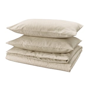 Three beige pillows with zigzag patterns neatly stacked.