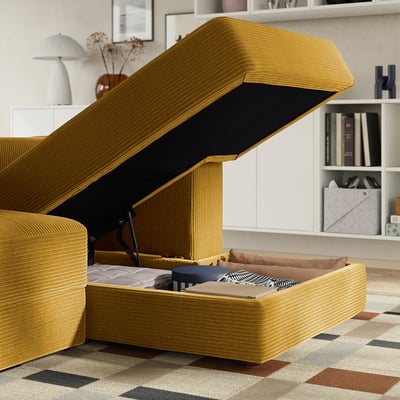 Mustard sofa with open storage. It reveals a hidden bed, ideal for guests. High back, soft cushions.