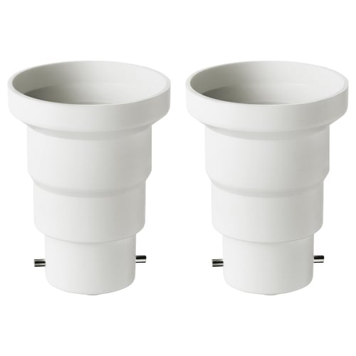 Two white plastic KOPPLA adapters convert b22 to e27 sockets, cylindrical with smooth design.