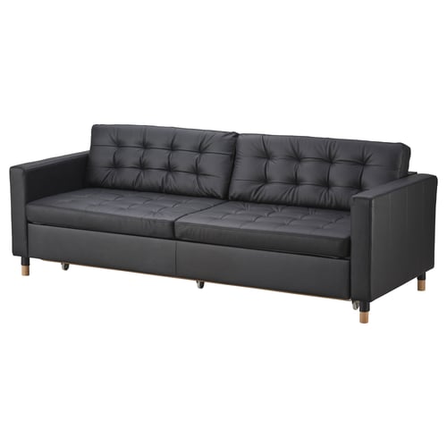 Black leather sofa, LANDSKRONA. Modern design, tufted cushions, wooden legs.