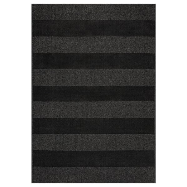 A LANDSVÄG area rug in dark grey with horizontal stripes. It is rectangular, soft, and made from polyester and polypropylene.