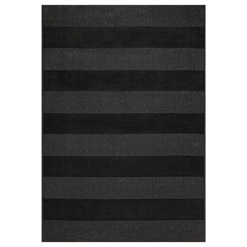 A LANDSVÄG area rug in dark grey with horizontal stripes. It is rectangular, soft, and made from polyester and polypropylene.