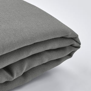 Folded grey fabric close-up, showing texture and quality.