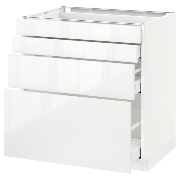 A white METOD kitchen cabinet with multiple drawers. Its modern, glossy, and smooth-running drawers.