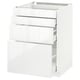 White METOD kitchen cabinet with three open drawers.