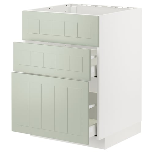 A METOD kitchen cabinet with green stensund fronts, featuring drawers and a door, in a white frame.