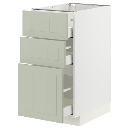 Modern kitchen unit with 3 light green drawers, white base, sleek and minimalist design.