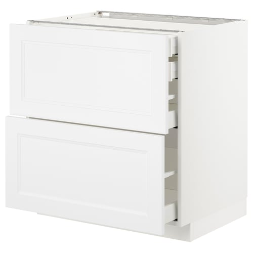 White METOD kitchen unit with closed and open drawers, sleek modern design.