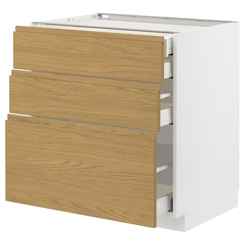 A white METOD kitchen cabinet with wooden finish drawers.