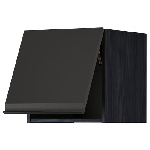 METOD kitchen unit in matte black with angled door.