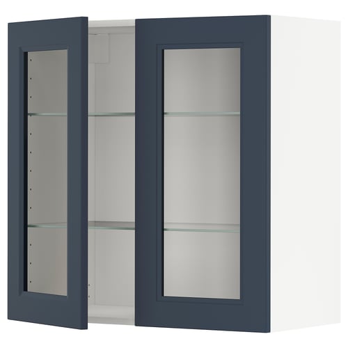 An open, dark blue wall cabinet. The cabinet has glass shelves.