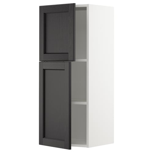 White METOD kitchen cabinet with black doors, one open.