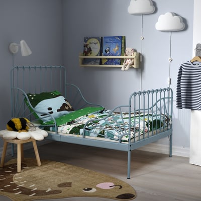Kids blue bedroom with MINNEN bed, toys, books, and cloud lights.