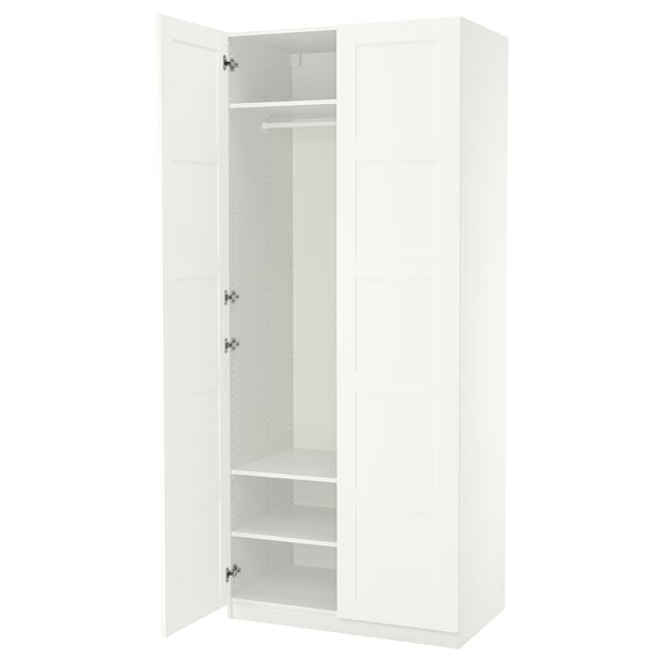 White PAX wardrobe, minimalist design, three compartments, hanging rail, two shelves, soft-close doors.